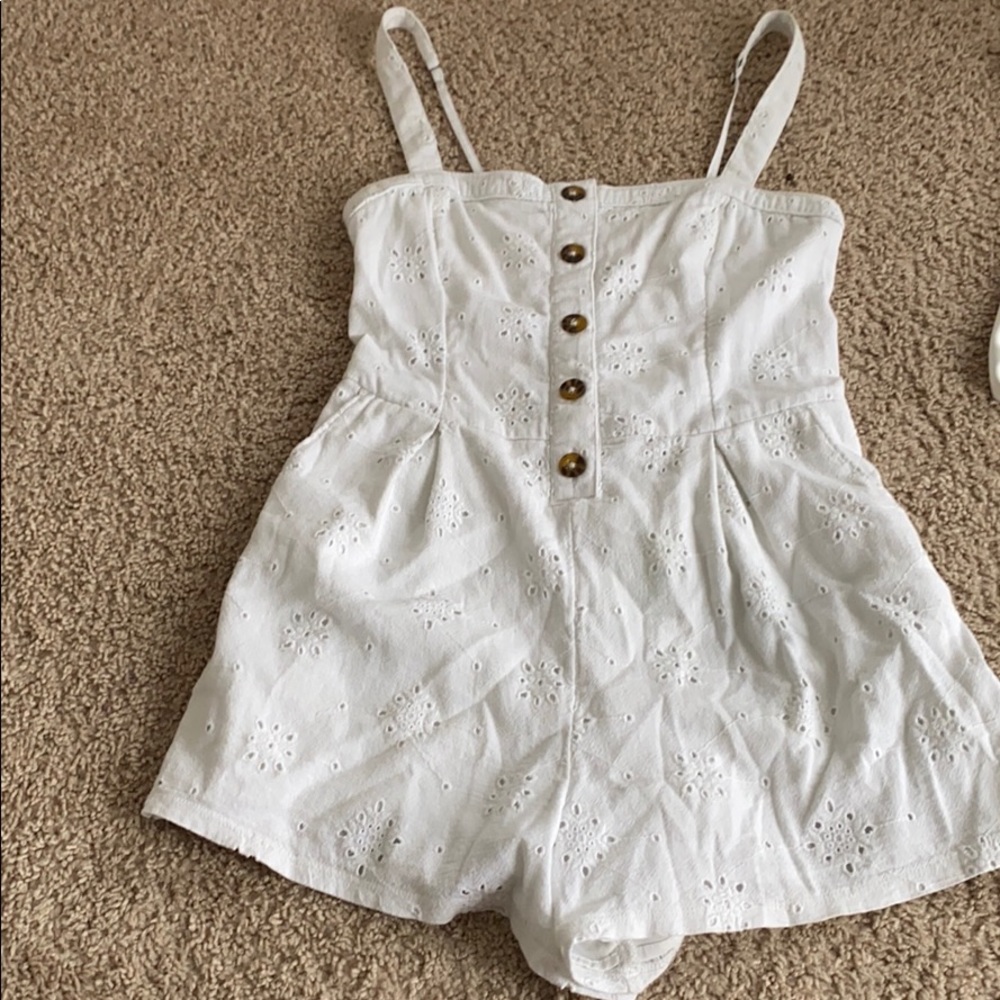 White romper with detail buttons